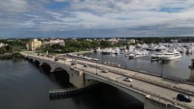 This 4K aerial video captures the engineering of the bridge that spans across the Intracoastal Waterway. The footage offers a unique perspective of the bridge and showcasing the bridge's design and its integration with the coastal landscape.
