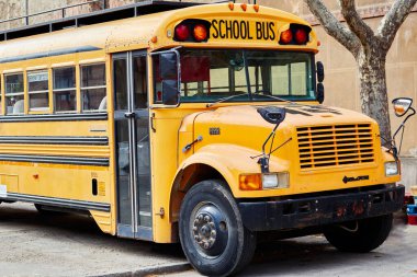 Typical american yellow school bus. Horizontal photography.