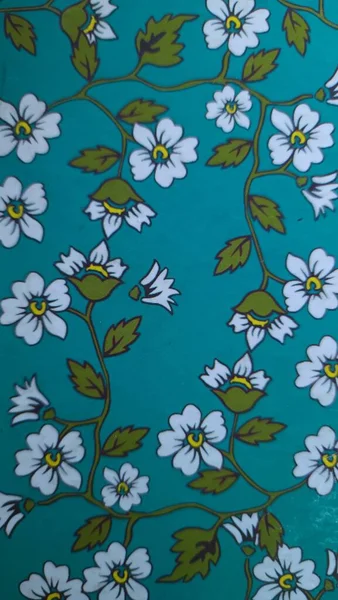 batik motifs of green flowers and birds of paradise