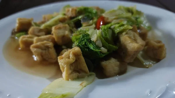 Fresh chicory sauted with tofu chunks for a healthy lunch