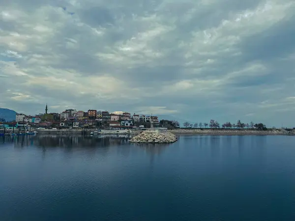 pier by the lake across the mountain