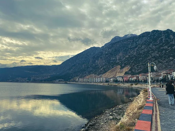 pier by the lake across the mountain