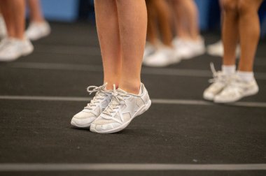 Young peoples feet in an aerobic exercise class.
