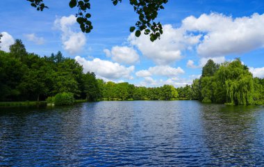 Paddelteich in Bad Wuenneberg. Idyllic landscape at the lake with green nature.