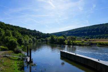 View from the Wilhelmshausen lock in the Fulda valley in Hesse. Landscape at the Fulda with the surrounding nature.