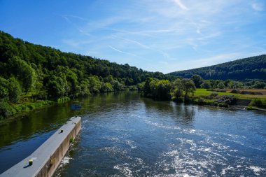 View from the Wilhelmshausen lock in the Fulda valley in Hesse. Landscape at the Fulda with the surrounding nature.