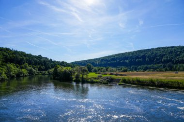 View from the Wilhelmshausen lock in the Fulda valley in Hesse. Landscape at the Fulda with the surrounding nature.