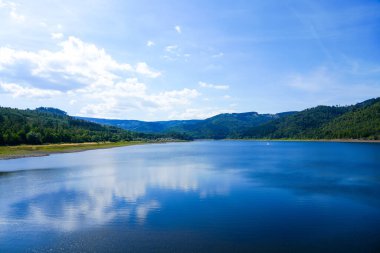 View of the Innerstetalsperre with the surrounding nature. Landscape at the Innerste reservoir. Lake in the Harz.