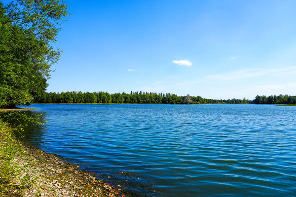 Landscape at the Koldinger Seen in the southern Leineaue. Nature reserve near Laatzen. Nature with lakes and green vegetation.