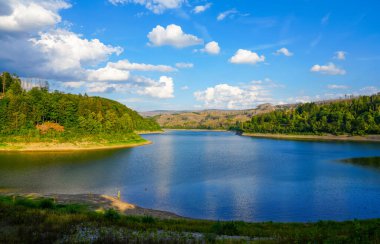 Soesetalsperre near Osterode am Harz. View of the reservoir with the surrounding idyllic nature. Landscape at the lake in the Harz National Park.