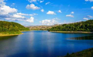 Soesetalsperre near Osterode am Harz. View of the reservoir with the surrounding idyllic nature. Landscape at the lake in the Harz National Park.