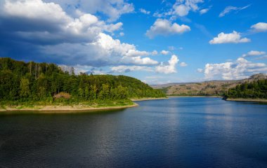 Soesetalsperre near Osterode am Harz. View of the reservoir with the surrounding idyllic nature. Landscape at the lake in the Harz National Park.