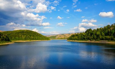 Soesetalsperre near Osterode am Harz. View of the reservoir with the surrounding idyllic nature. Landscape at the lake in the Harz National Park.