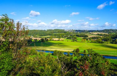 View of the Ruhr and the surrounding green landscape from the Ruhr slope. Nature on the river near Hattingen in the Ruhr area.