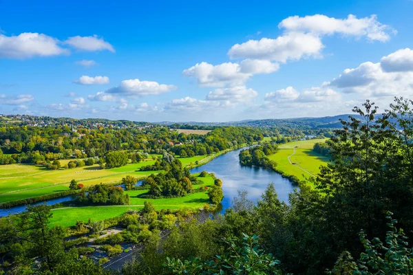 View of the Ruhr and the surrounding green landscape from the Ruhr slope. Nature on the river near Hattingen in the Ruhr area.