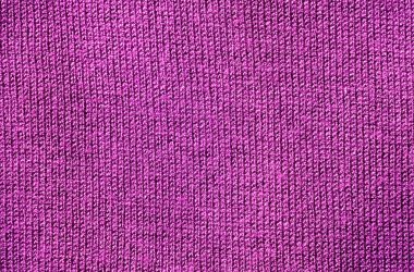Arkaplan olarak mor renkli kumaş yapısı.