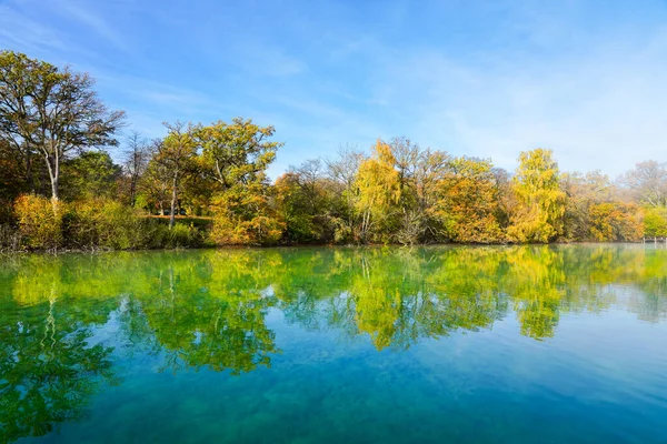 stock image Idyllic autumn landscape by the lake.