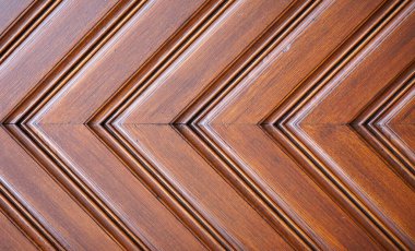 Arkaplan olarak ahşap kapının grafiksel yapısı. Kahverengi ahşap. Simetri.