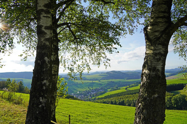 Landscape in the Sauerland near Oberhenneborn. Panoramic view of the green nature with hills and forests.