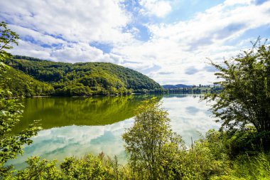Reservoir on the dam wall at Diemelsee and the surrounding landscape. Nature at the Diemel Dam in the Sauerland.