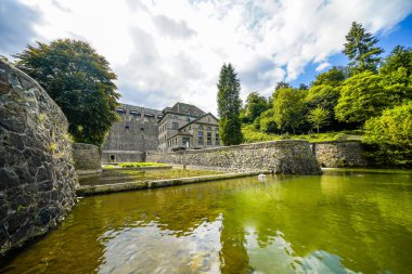 Dam wall at Diemelsee and the surrounding landscape. Diemel Dam in Sauerland. Historical building for water supply.