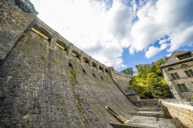 Dam wall at Diemelsee and the surrounding landscape. Diemel Dam in Sauerland. Historical building for water supply.