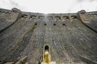 Dam wall at Diemelsee and the surrounding landscape. Diemel Dam in Sauerland. Historical building for water supply.