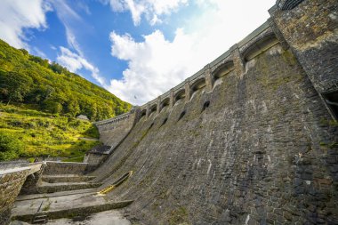 Dam wall at Diemelsee and the surrounding landscape. Diemel Dam in Sauerland. Historical building for water supply.