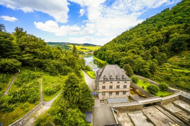 Dam wall at Diemelsee and the surrounding landscape. Diemel Dam in Sauerland. Historical building for water supply.