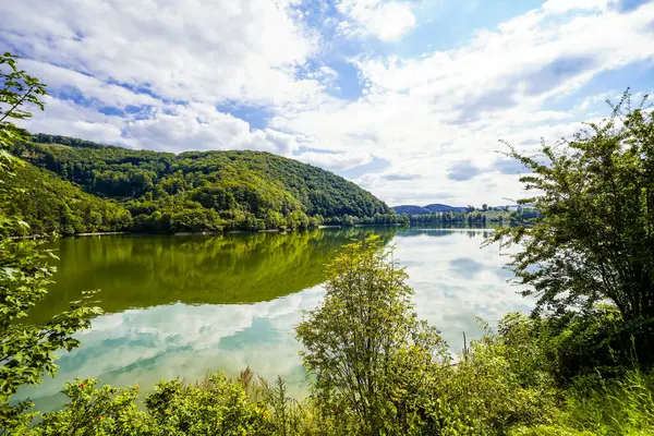 Reservoir on the dam wall at Diemelsee and the surrounding landscape. Nature at the Diemel Dam in the Sauerland.