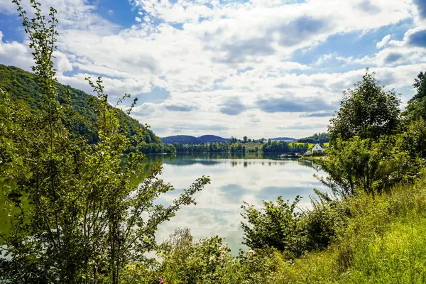 Reservoir on the dam wall at Diemelsee and the surrounding landscape. Nature at the Diemel Dam in the Sauerland.