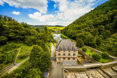 Dam wall at Diemelsee and the surrounding landscape. Diemel Dam in Sauerland. Historical building for water supply.