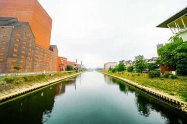 View of the surrounding area at the harbor in Duisburg. Industrial port on the Ruhr. Building of the State Archives of North Rhine-Westphalia.