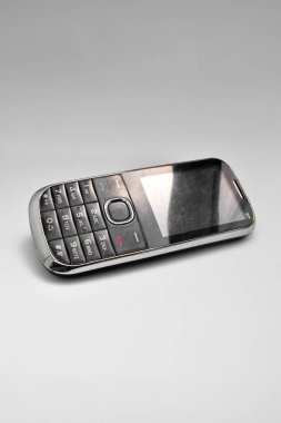 Old phone with buttons on white background