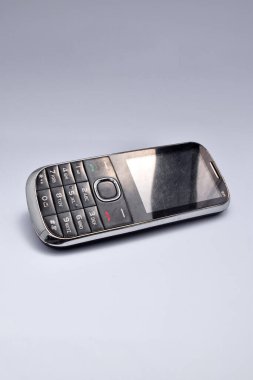 Old phone with buttons on white background