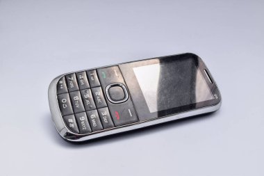 Old phone with buttons on white background