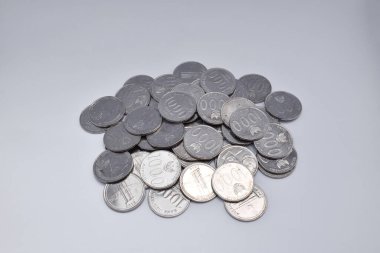 Pile of Indonesian thousand rupiah coins isolated on a white background
