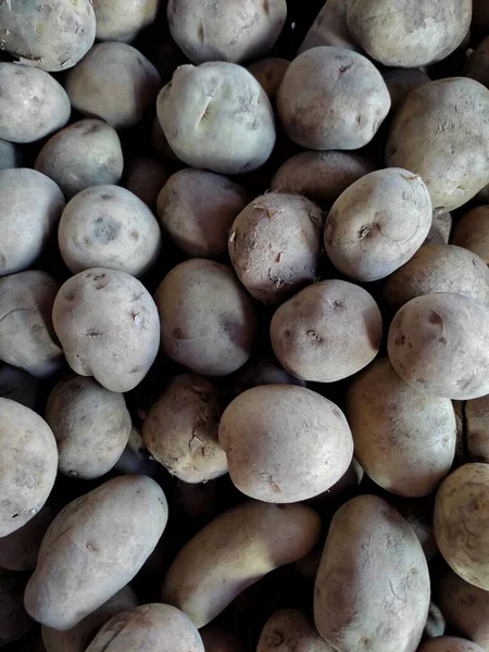 Pile of small sized potatoes on the market with a high angle shot