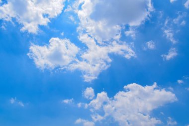 Deep blue skies with white clouds background, blue cloudy skies texture, dark blue sky wallpaper with with white fully clouds and sunlight.