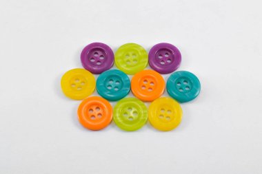 Collection of color buttons for clothes isolated on white background.