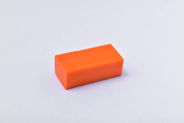 Orange eraser isolated on white background