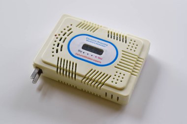 Close-up of electronic moisture absorber isolated on white background. Recycling silica gel.