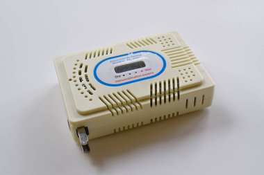 Close-up of electronic moisture absorber isolated on white background. Recycling silica gel.