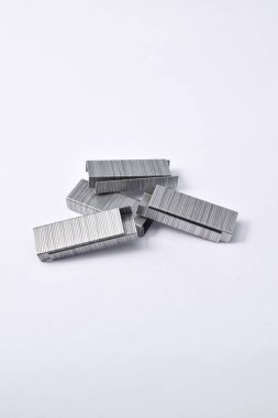 Pile of metal staples for stapler isolated on white background