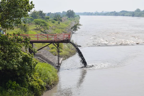 Disposal of Lapindo mud water into the Porong river, East Java