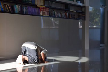 Solo, 07 Juli 2022 - Muslim praying, prostrating on the floor of mosque