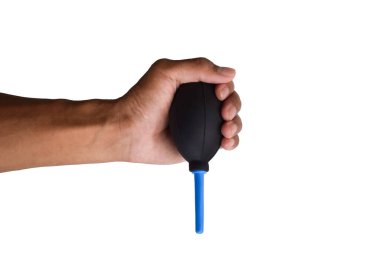 A hand holding manual hand pump air blower or rubber dust blower isolated on white background. Lens and Camera cleaning items.