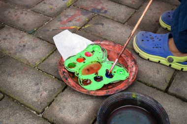 The Paints and brush.Old artist s paints. Multicolored paint set