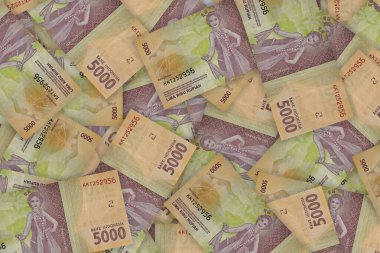 Portrait from Indonesian 5000 Rupiah 2016 Banknotes. Pile of old Indonesian rupiah banknotes series