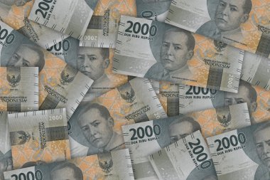 Portrait from Indonesian 2000 Rupiah 2016 Banknotes. Pile of old Indonesian rupiah banknotes series. IDR 2.000